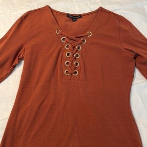 Rust color top with brass rings